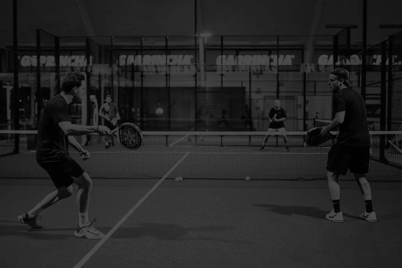 Padel play in action black and white