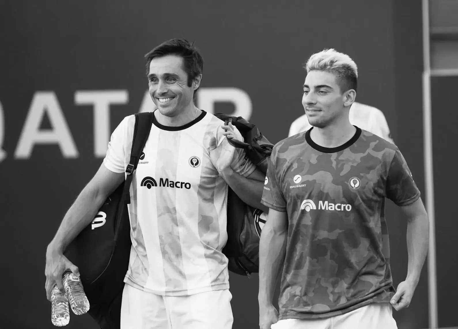 Argentine padel players Fernando Belasteguín and Martín Di Nenno smile after a match at the 2020 World Championship in Qatar.