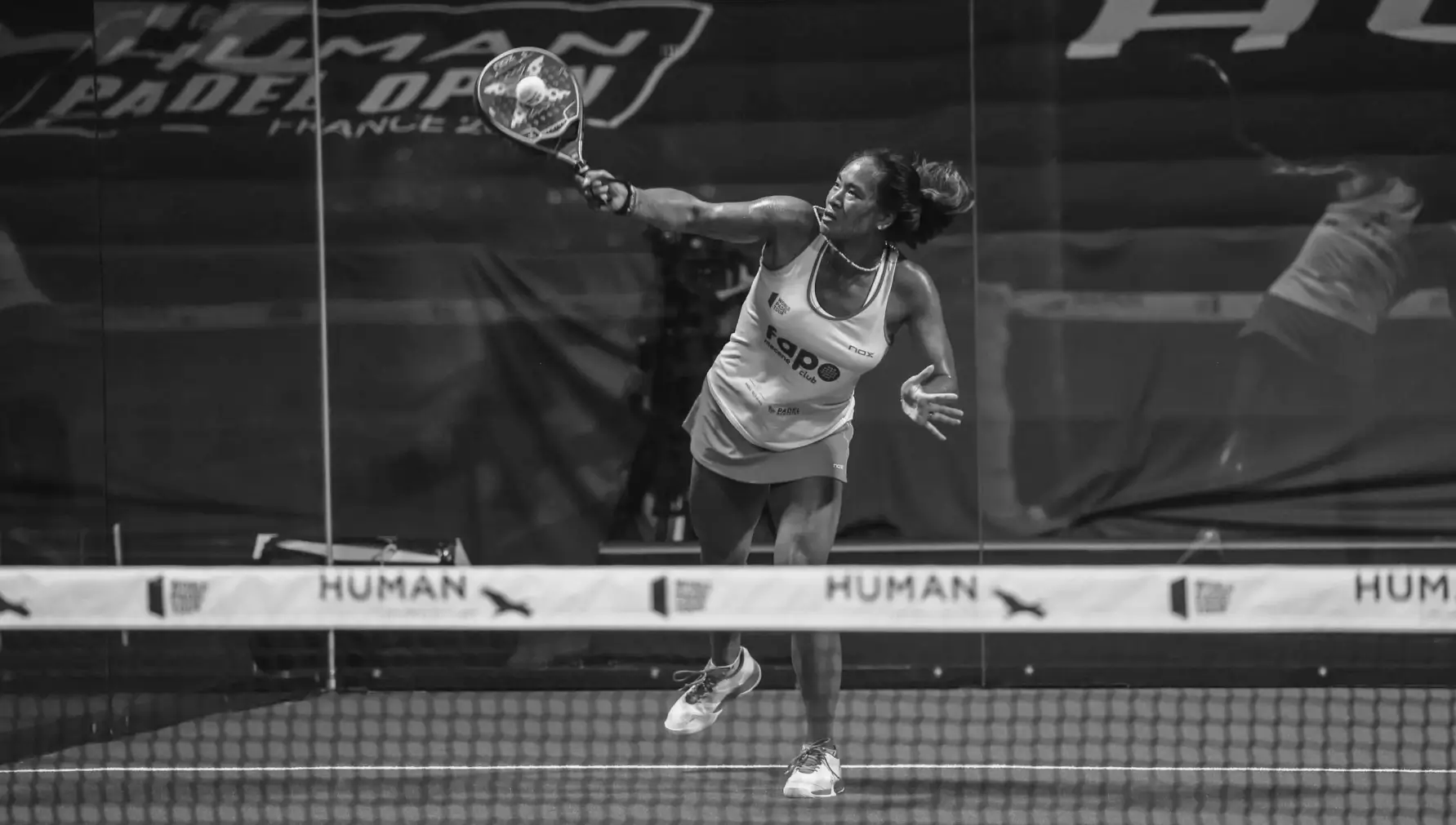 Women doing the Bandeja playing padel